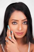 A close-up image of a person with purple contact lenses, showing the eyes and the lenses' effect on the eyes.