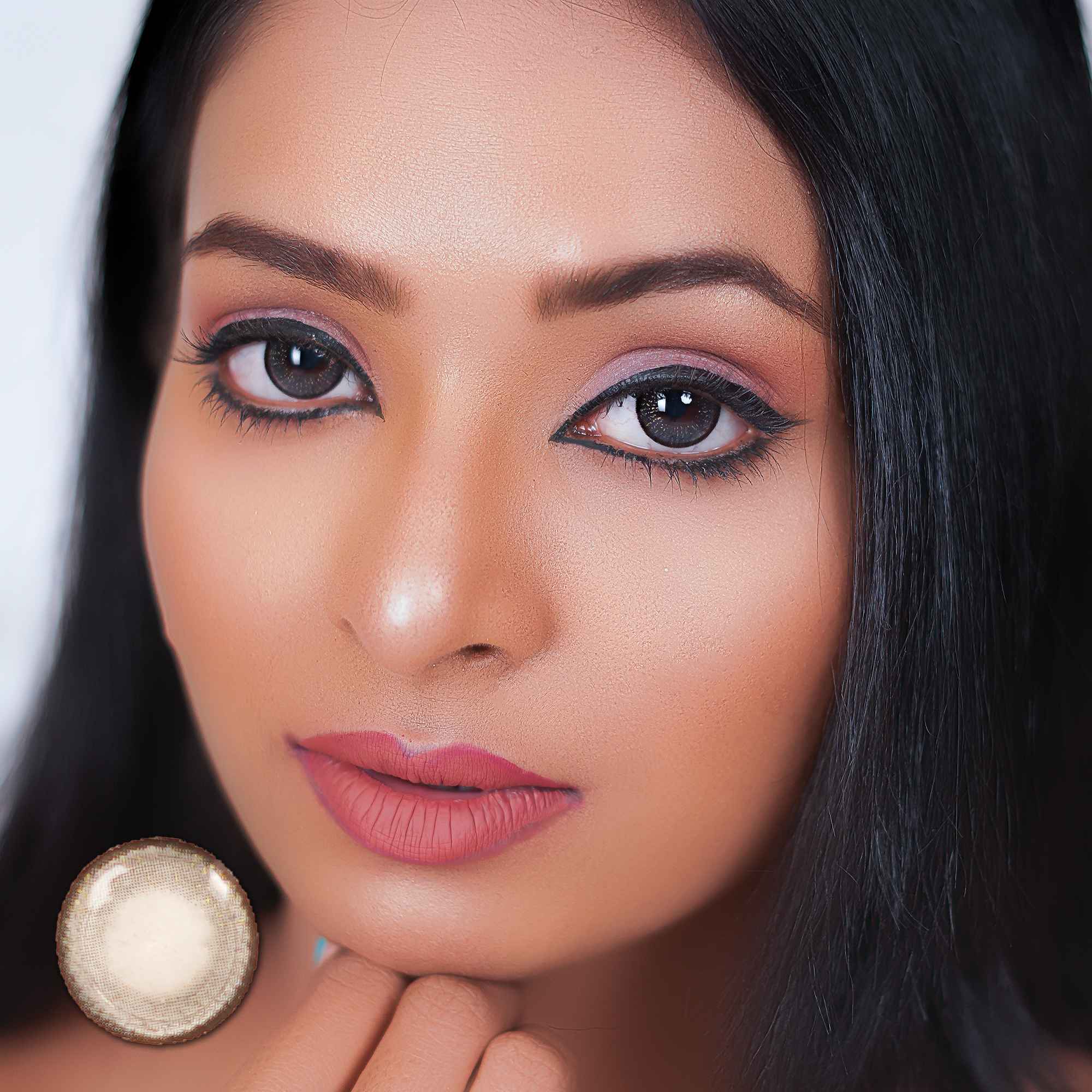 Close-up image of a woman's face with light gray colored contact lenses, showcasing the lens effect on the eyes.